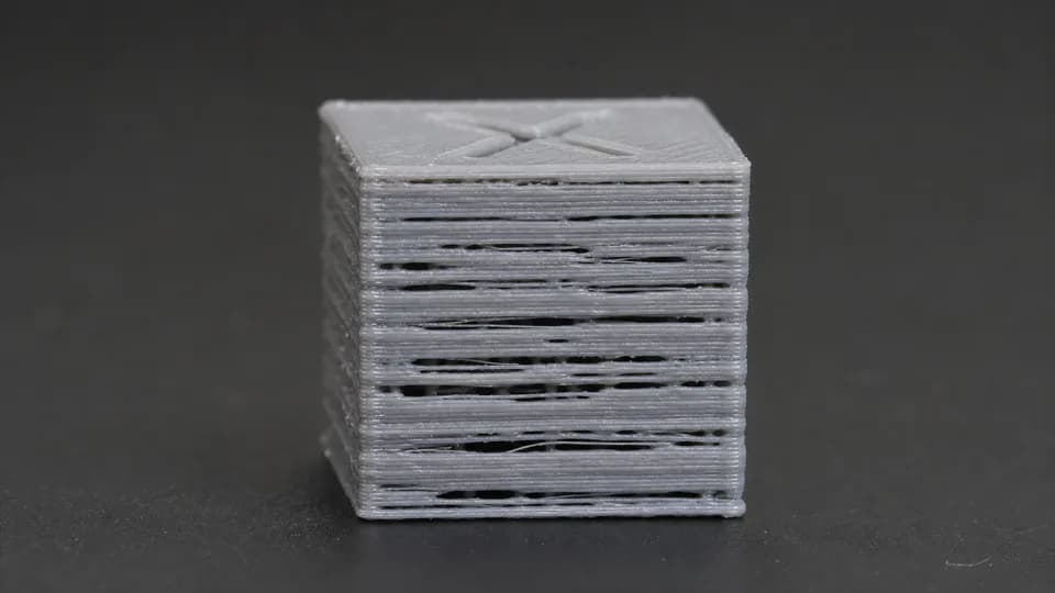Illustrative under-extruded 3D print with gaps between layers