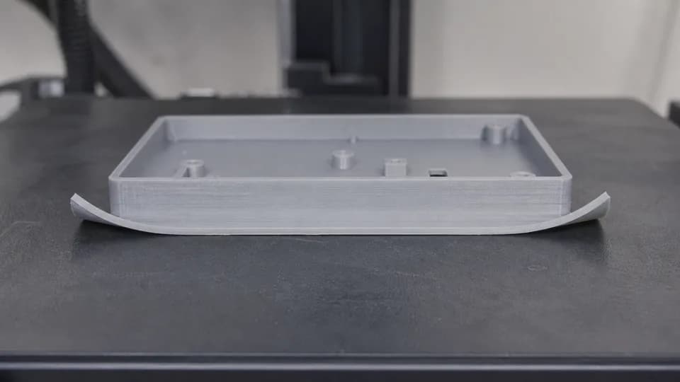 Illustrative 3D printed part with lifted corners
