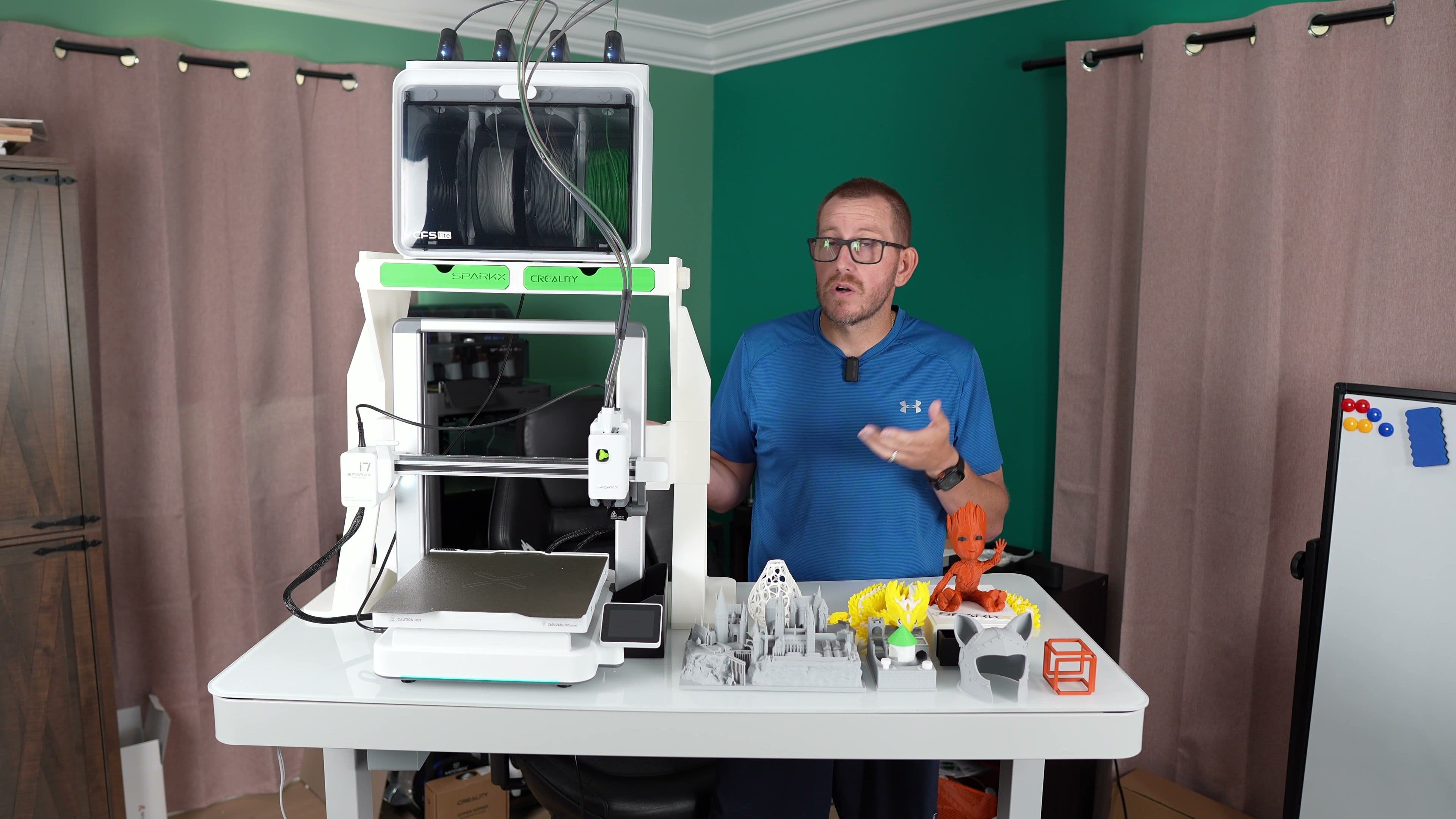 Rob standing beside a Creality SparkX i7 printer during hands-on coverage