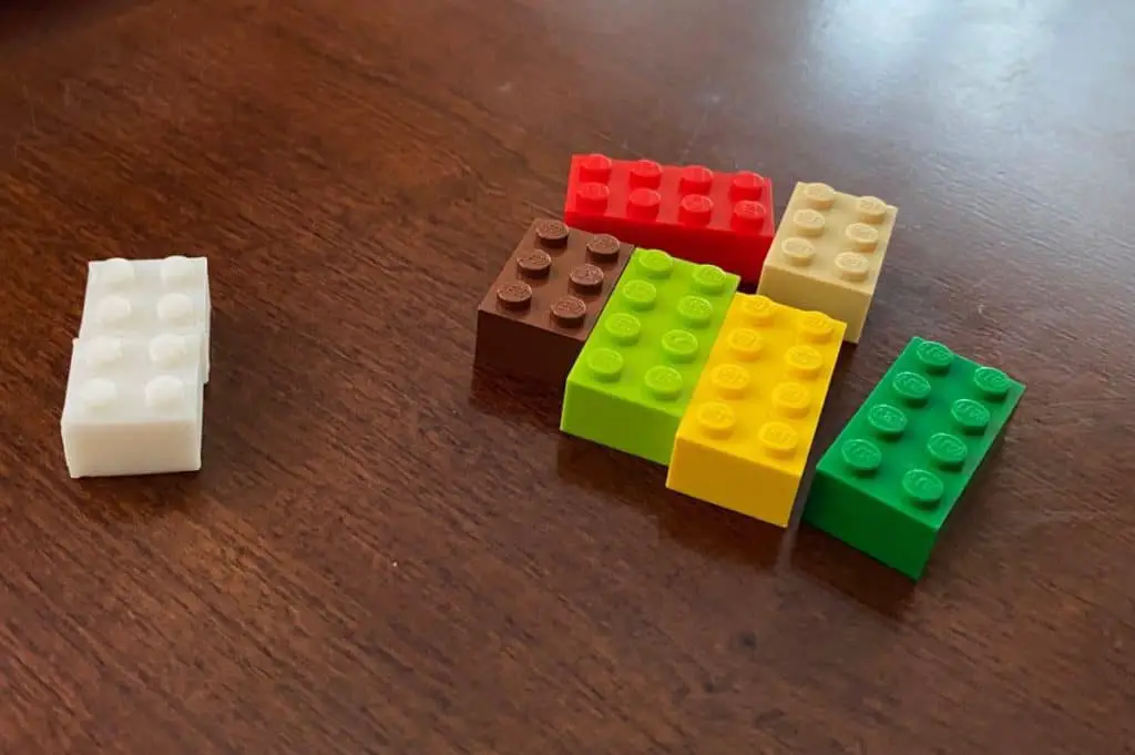 Lgos next to printed lego bricks